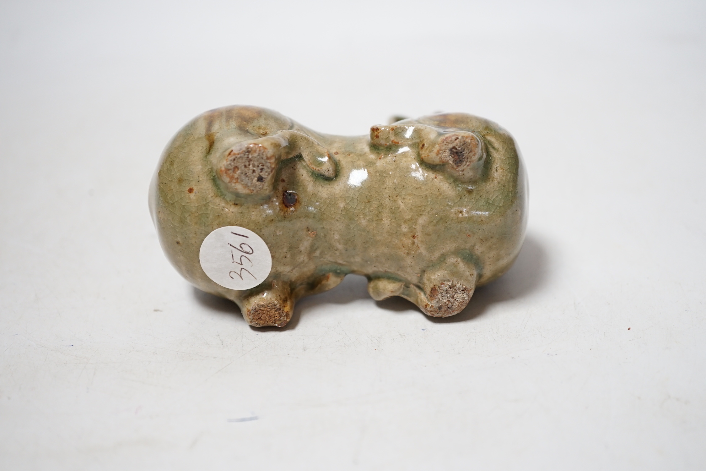 A Chinese Yue type green glazed model of a ram, 10cm wide